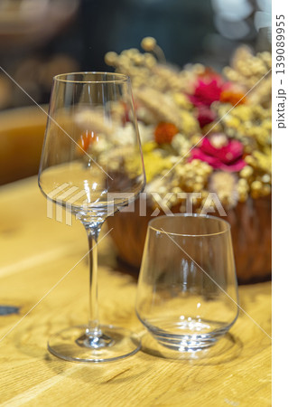 Empty glasses on table near autumn decoration 139089955