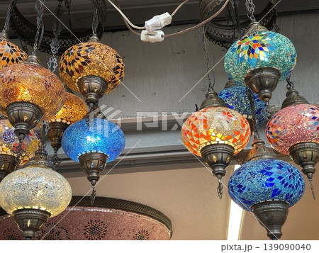 Colorful mosaic lamps in a market setting, showcasing intricate glass patterns Colorful mosaic lamps in a market setting, showcasing intricate glass patterns 139090040