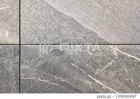 Elegant gray marble tiles showcasing intricate textures and patterns 139090497