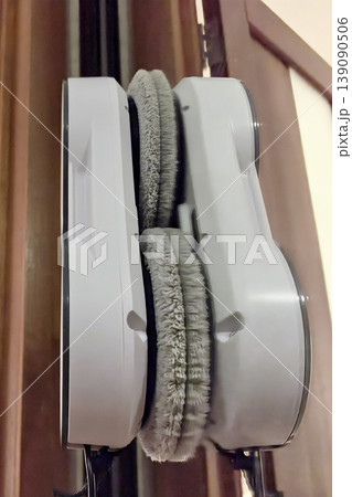 Window robot cleaner scrubbing glass with precision and ease at home 139090506