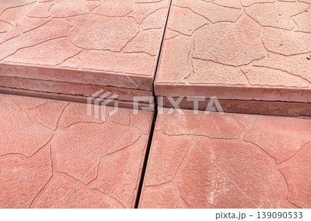 Textured stone pathway showcases intricate details in afternoon light Textured stone pathway showcases intricate details in afternoon light 139090533