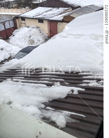 Winter's embrace on a snow-covered rooftop in a quiet neighborhood 139090572