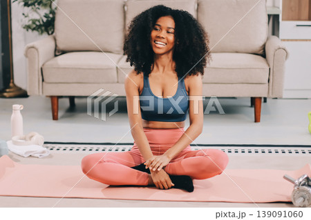 Women exercising in fitness studio yoga classes Women exercising in fitness studio yoga classes 139091060
