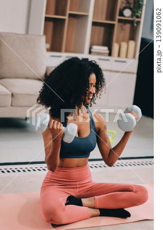 Women exercising in fitness studio yoga classes Women exercising in fitness studio yoga classes 139091062