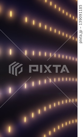 Warm golden dotted lights forming flowing lines on a dark background, elegant abstract glow pattern for festive and luxury designs 139091185