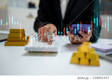 Gold investment concept with businesswoman analyzing market data on tablet, stack of gold bars. 139091457