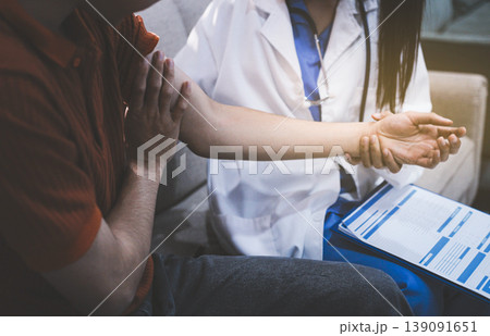 Healthcare worker providing empathetic support and care, gently placing hands on a senior woman's arm Healthcare worker providing empathetic support and care, gently placing hands on a senior woman's arm 139091651