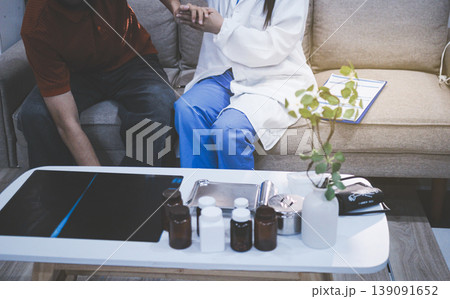 Healthcare worker providing empathetic support and care, gently placing hands on a senior woman's arm Healthcare worker providing empathetic support and care, gently placing hands on a senior woman's arm 139091652