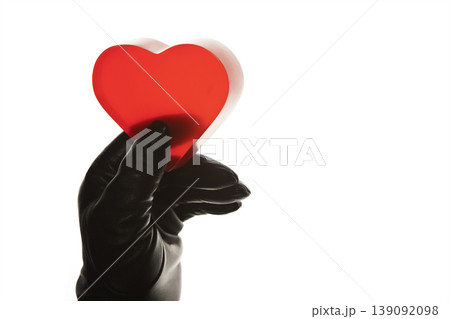 Love Concept Female Gloved Hand Holding Crystal Heart. Glass Heart in Woman Hand Minimal Concept. 139092098