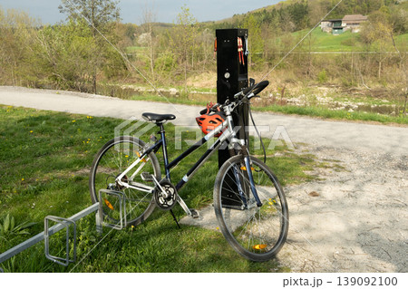 Public bicycle repair station on a scenic bike path. 139092100