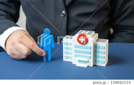 Figure a man near the hospital building Figure a man near the hospital building 139092514