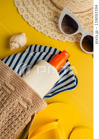 Sunscreen skin protection. Summer holiday flat lay yellow background. Beach travel accessories for vacation. Sunglasses, sun hat, sunscreen. Sunscreen skin protection. Summer holiday flat lay yellow background. Beach travel accessories for vacation. Sunglasses, sun hat, sunscreen. 139093394