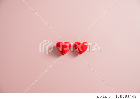 Valentine Day background with red hearts over pink background. St. Valentine's Day love concept, flat lay with copy space Valentine Day background with red hearts over pink background. St. Valentine's Day love concept, flat lay with copy space 139093445