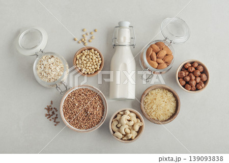 bottles with vegan milk on concrete a kitchen table bottles with vegan milk on concrete a kitchen table 139093838