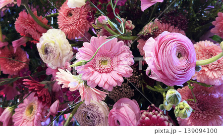 Background of mixed gerbera flowers in various colors. Bright gerbera floral composition with fresh petals and vibrant natural beauty. 139094100