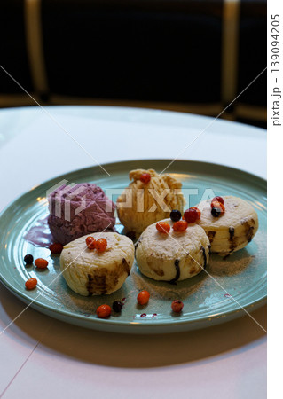 Delicious dessert platter showcasing vibrant flavors and creative presentation 139094205