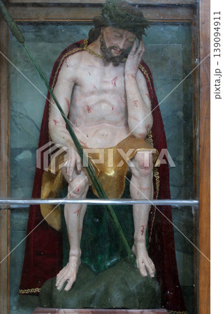 Wounded Jesus, statue on the altar of the Holy Cross in the Church of the Assumption of the Virgin Mary in Klostar Ivanic, Croatia Wounded Jesus, statue on the altar of the Holy Cross in the Church of the Assumption of the Virgin Mary in Klostar Ivanic, Croatia 139094911