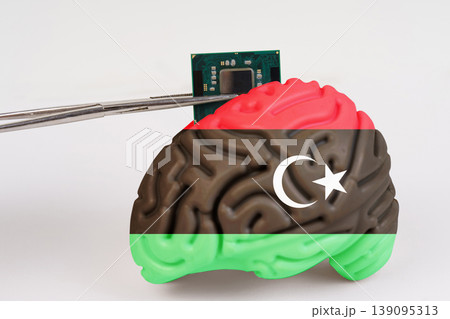 On a white background, a model of the brain with a picture of a flag - Libya, a microcircuit, a processor, is implanted into it. 139095313