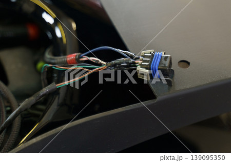 Electric plug of car, motorcycle. Close-up. Transport concept Electric plug of car, motorcycle. Close-up. Transport concept 139095350