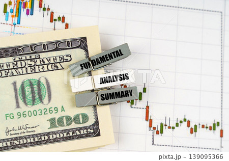 On the quote chart there are dollars and clothespins with the inscription - Fundamental Analysis Summary On the quote chart there are dollars and clothespins with the inscription - Fundamental Analysis Summary 139095366