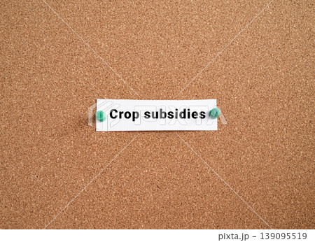 Crop subsidies label note pinned on cork bulletin board. USA federal agriculture farming policy finance concept Crop subsidies label note pinned on cork bulletin board. USA federal agriculture farming policy finance concept 139095519