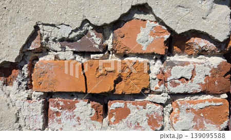 Old brick masonry with crumbling plaster, weathered rustic wall texture for construction, architecture, renovation concepts and urban grunge backgrounds. Old brick masonry with crumbling plaster, weathered rustic wall texture for construction, architecture, renovation concepts and urban grunge backgrounds. 139095588