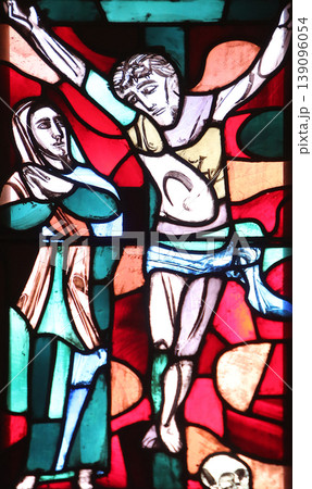 Mary under the Cross, stained glass window in Basilica of St. Vitus in Ellwangen, Germany Mary under the Cross, stained glass window in Basilica of St. Vitus in Ellwangen, Germany 139096054