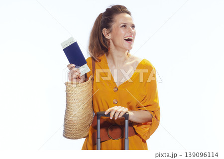 Happy Woman Traveler Holding Passport and Boarding Pass 139096114