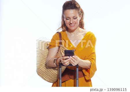 Woman Traveler Looking at Smartphone during Trip Planning Woman Traveler Looking at Smartphone during Trip Planning 139096115