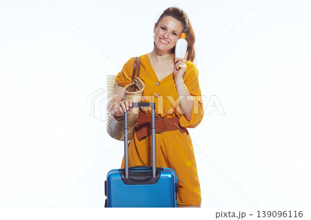 Happy Vacationer Holding Sunscreen Bottle with Suitcase Happy Vacationer Holding Sunscreen Bottle with Suitcase 139096116