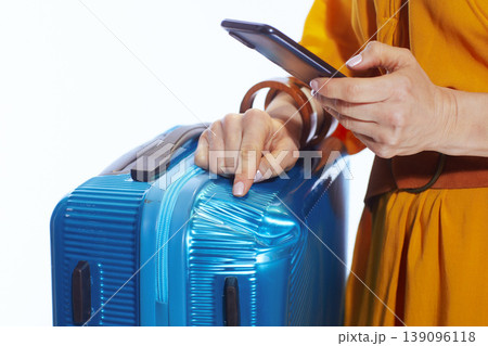 Traveler Pointing to Suitcase Damage While Filing Claim Traveler Pointing to Suitcase Damage While Filing Claim 139096118