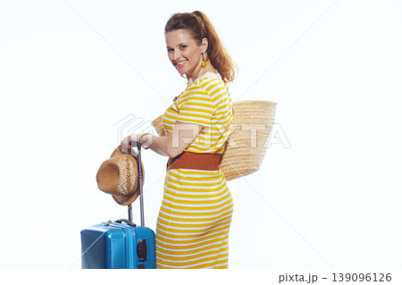 Happy Woman with Summer Accessories and Rolling Suitcase Happy Woman with Summer Accessories and Rolling Suitcase 139096126