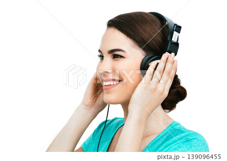 Audiometry, hearing exam. Positive Hispanic woman wearing special headphones getting a hearing diagnostic. Check-up your hear 139096455