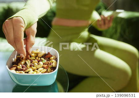 Mindful Snacking in Sportswear - Healthy Nut Mix Mindful Snacking in Sportswear - Healthy Nut Mix 139096531