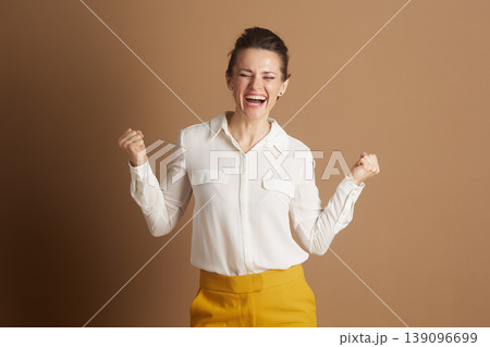 Triumphant Business Woman Celebrates Success 139096699