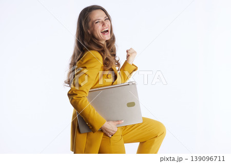 Joyful Businesswoman Celebrating with Laptop 139096711