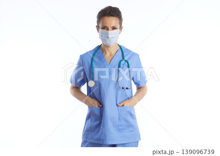 Doctor in Surgical Mask and Medical Scrubs Doctor in Surgical Mask and Medical Scrubs 139096739