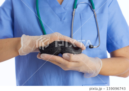 Medical Professional with Mustache Prop for Health Campaign Medical Professional with Mustache Prop for Health Campaign 139096743