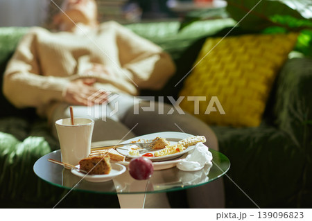 Feeling Unwell on the Sofa After Binge Eating 139096823