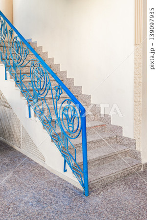 stairs with metal openwork handrails 139097935