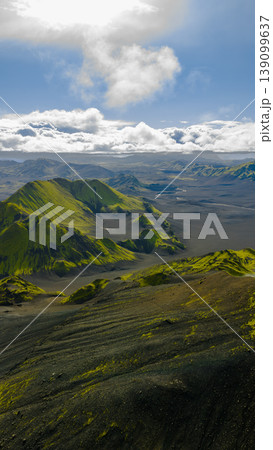 Aerial View of Moss Covered Mountains and Black Sand Plains in Iceland Aerial View of Moss Covered Mountains and Black Sand Plains in Iceland 139099637