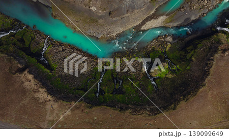 Aerial View of Turquoise River and Waterfalls in Icelandic Landscape Aerial View of Turquoise River and Waterfalls in Icelandic Landscape 139099649