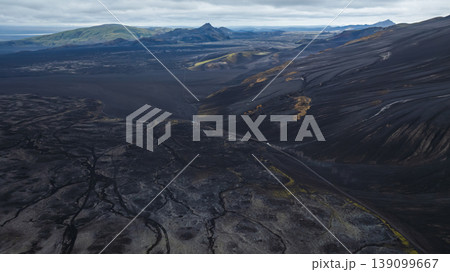 Aerial View of Volcanic Landscape and Winding Road in Iceland Aerial View of Volcanic Landscape and Winding Road in Iceland 139099667