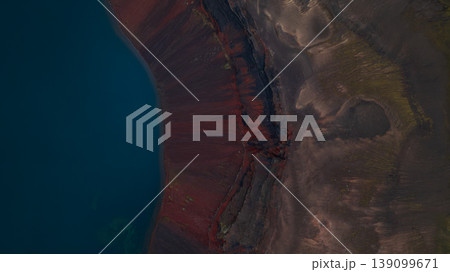 Aerial View of Volcanic Landscape and Deep Blue Water in Iceland Aerial View of Volcanic Landscape and Deep Blue Water in Iceland 139099671