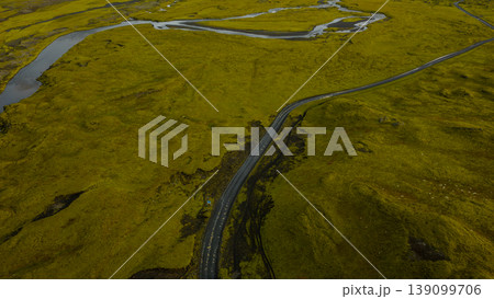Aerial View of Winding Road Through Moss Covered Volcanic Terrain 139099706