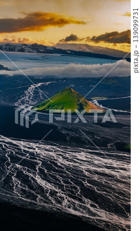 Aerial View of Green Volcanic Hill and Glacier in Iceland 139099731