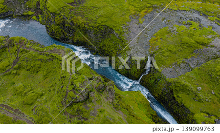 Aerial View of Moss Covered Canyon with River and Waterfall in Iceland Aerial View of Moss Covered Canyon with River and Waterfall in Iceland 139099763