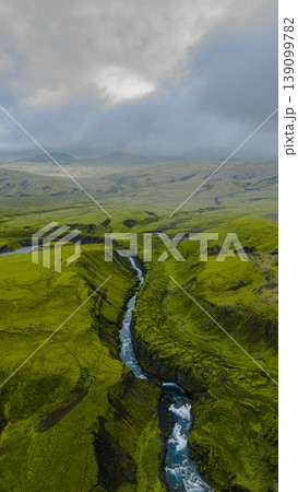 Aerial View of Icelandic Canyon with Winding River and Mossy Terrain Aerial View of Icelandic Canyon with Winding River and Mossy Terrain 139099782