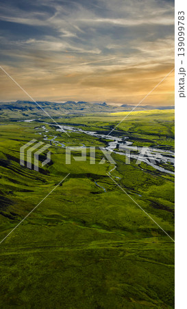 Aerial View of Moss Covered Terrain and Rivers in Iceland at Sunset Aerial View of Moss Covered Terrain and Rivers in Iceland at Sunset 139099783