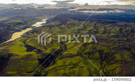 Aerial View of Iceland's Green Hills, Volcanic Terrain, and River Aerial View of Iceland's Green Hills, Volcanic Terrain, and River 139099802